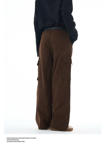 Rear view of brown wide-leg cargo pants with flap pockets and high-quality cotton texture