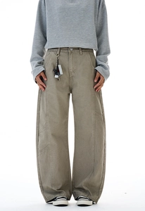 Detail of high street vintage paneled work pants with wide-leg cut and side seam stitching