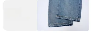 Detailed close-up of light blue denim jeans leg opening with sturdy yellow topstitching
