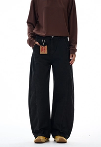 Detail view of black vintage cargo pants featuring contrast stitching and a waist size tag