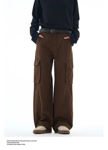 Brown wide-leg cargo pants featuring flap pockets and premium cotton twill texture