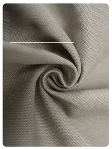 Macro shot of breathable cotton twill fabric texture and soft spiral folds on casual pants