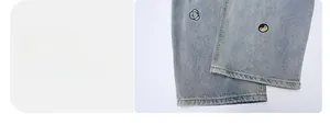 Detailansicht des Beinsaums an hellblauen Jeans mit niedlicher Cartoon-Stickerei