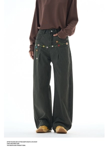 Detailed embroidery of colorful flowers on vintage wide-leg dark grey denim pants