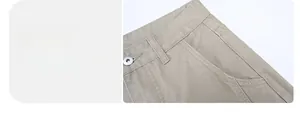 Detail of khaki American high street cargo pants showing metal button and pocket stitching