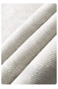 Macro shot of high-quality off-white twill fabric texture for men's casual trousers
