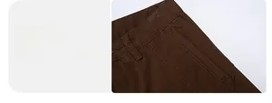 Detail view of brown cargo pants showing sturdy waist belt loops and deep side pockets