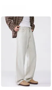 Detail view of men's loose white straight-leg denim jeans with cleanfit casual style