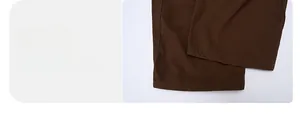 Detail view of the flat-sewn leg opening on high-quality dark brown cargo trousers