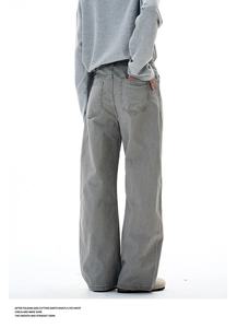 Rear view of grey washed wide-leg trousers with floral embroidery and square pockets