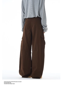 Rear view of loose-fit dark brown cargo pants featuring wide-leg cut and large side pockets