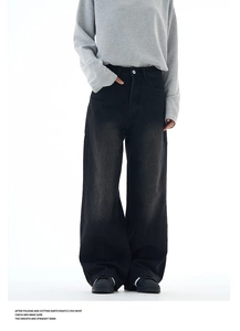 Detail view of washed dark grey retro wide leg jeans with vintage whiskers and loose fit