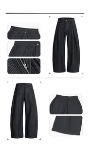 Detailed close-up of dark striped wide-leg trousers showing waistband and fabric texture