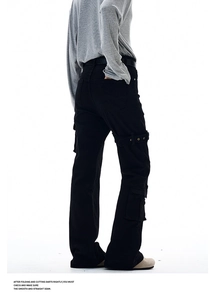 Close-up of cargo pants featuring utility buckles and large side pockets on the leg