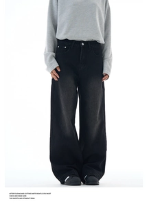 Front view of black wide-leg washed denim jeans with stack effect on a white background