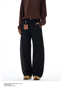 Detail of high street vintage black cargo pants with contrast stitching and tag