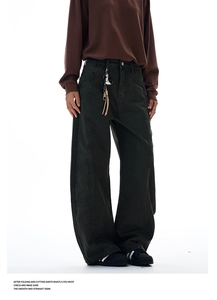 Detailed view of high-waisted workwear pants with silver buttons and contrast stitching