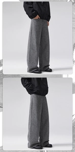 Dettaglio dei pantaloni larghi grigio antracite con trama denim pesante e taglio dritto