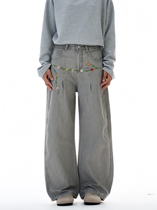 Men's grey wide-leg curved jeans with colorful floral embroidery in American streetwear style