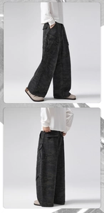 Macro detail of baggy camouflage cargo pants with utility pockets and vintage faded wash