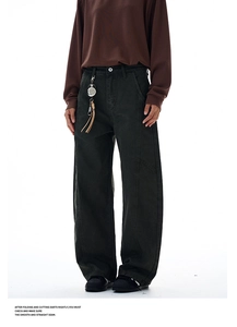 Detail of high-waisted wide-leg trousers with heavy twill fabric and metal keyhook