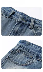 Detailed close-up of blue stone-washed denim waist structure with metal button and rivets