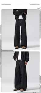 Detail view of vintage raw denim black wide-leg jeans with crisp stitching and long silhouette