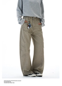 Detail of cargo pants showing contrast stitching and waist keychain accessory