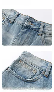 Close-up of light blue washed denim jeans with vintage buttons and coin pocket details