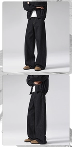 Detail view of black wide-leg denim pants showing contrast stitching and stiff texture