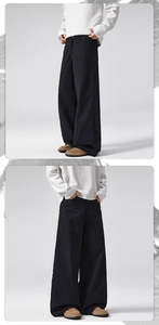 Detail view of men's wide-leg black cotton trousers with retro oversized loose fit cut