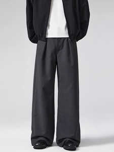Men's dark gray wool wide-leg pleated trousers with a minimalist relaxed straight fit