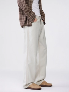 Men's loose straight-leg off-white denim trousers with contrast stitching detail