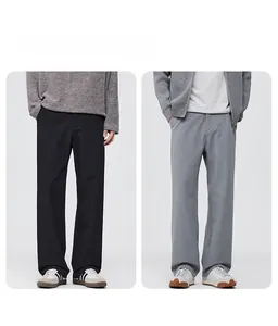 Detail view of straight-leg men trousers in black and gray with smooth drape fabric