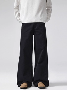 Men's retro minimalist black wide-leg trousers in cotton with a loose fit and drape