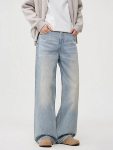 Men's loose light blue wash straight jeans with vintage wide-leg fit and denim texture