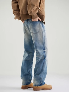 Men's light blue stone washed straight leg denim pants with vintage cat-whisker effect