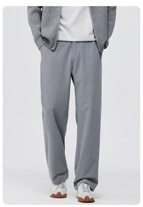 Detail view of grey wide-leg trousers featuring vertical pleats and straight-cut drape finish