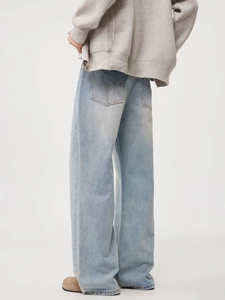 Men's light blue wide leg denim jeans with vintage wash and loose straight fit cut