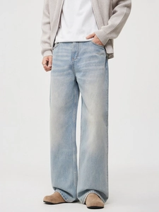 Men's light blue washed wide-leg denim jeans with a straight fit and minimalist style