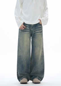 Wide leg jeans for men featuring retro wash and 3D whiskers detail on loose denim