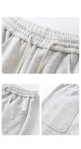 Vues détaillées du pantalon en maille gris avec taille élastique à cordon et poches