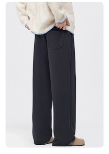 Detailed back view of men's wide-leg fleece trousers featuring a minimal patch pocket