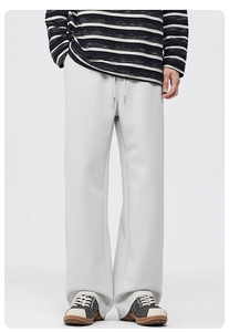 Fleece-lined light grey wide-leg casual pants showing thick fabric and loose straight fit