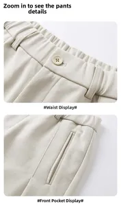 Détail du pantalon blanc cassé montrant la taille élastique, le bouton et les poches