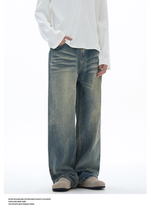 Detail of vintage wash denim with cat whiskers effect and heavy-duty stitching style