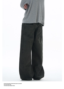 Detail of dark grey wide-leg cargo pants with vintage stitching and large back pockets