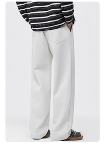 Detailed back view of off-white wide-leg trousers featuring a single minimalist rear pocket
