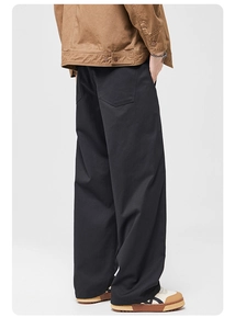 Rear side view of men's wide-leg black cargo pants showing loose fit and back pockets