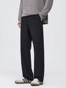 Mens straight leg black trousers with premium drape and textured fabric in a side view